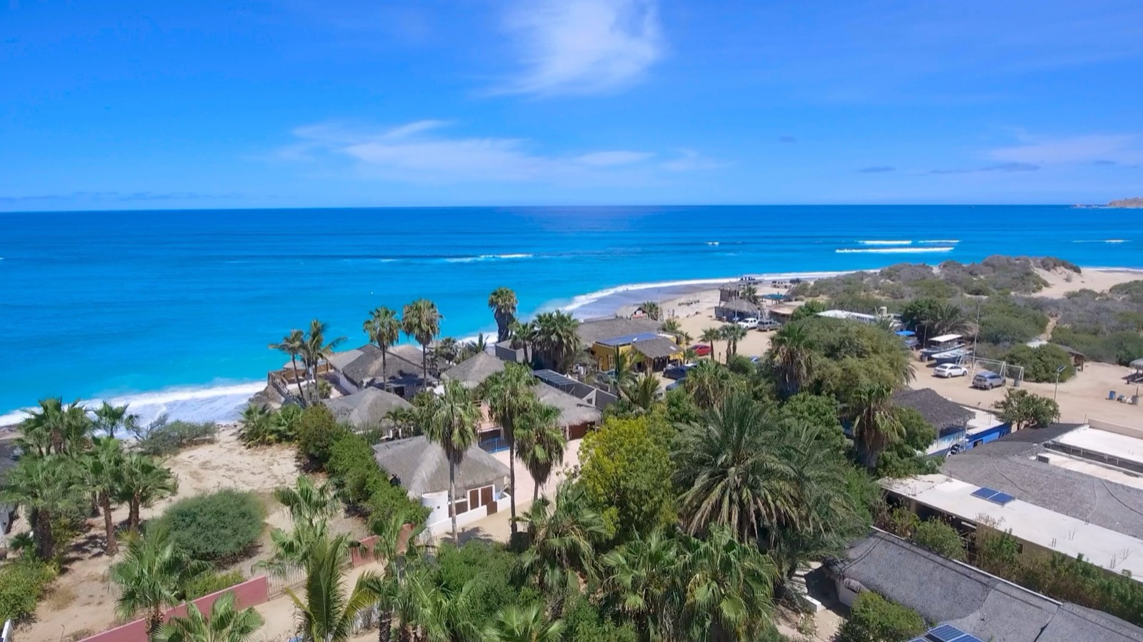 Cabo Pulmo from the air: the village under the palms and the coastline running north